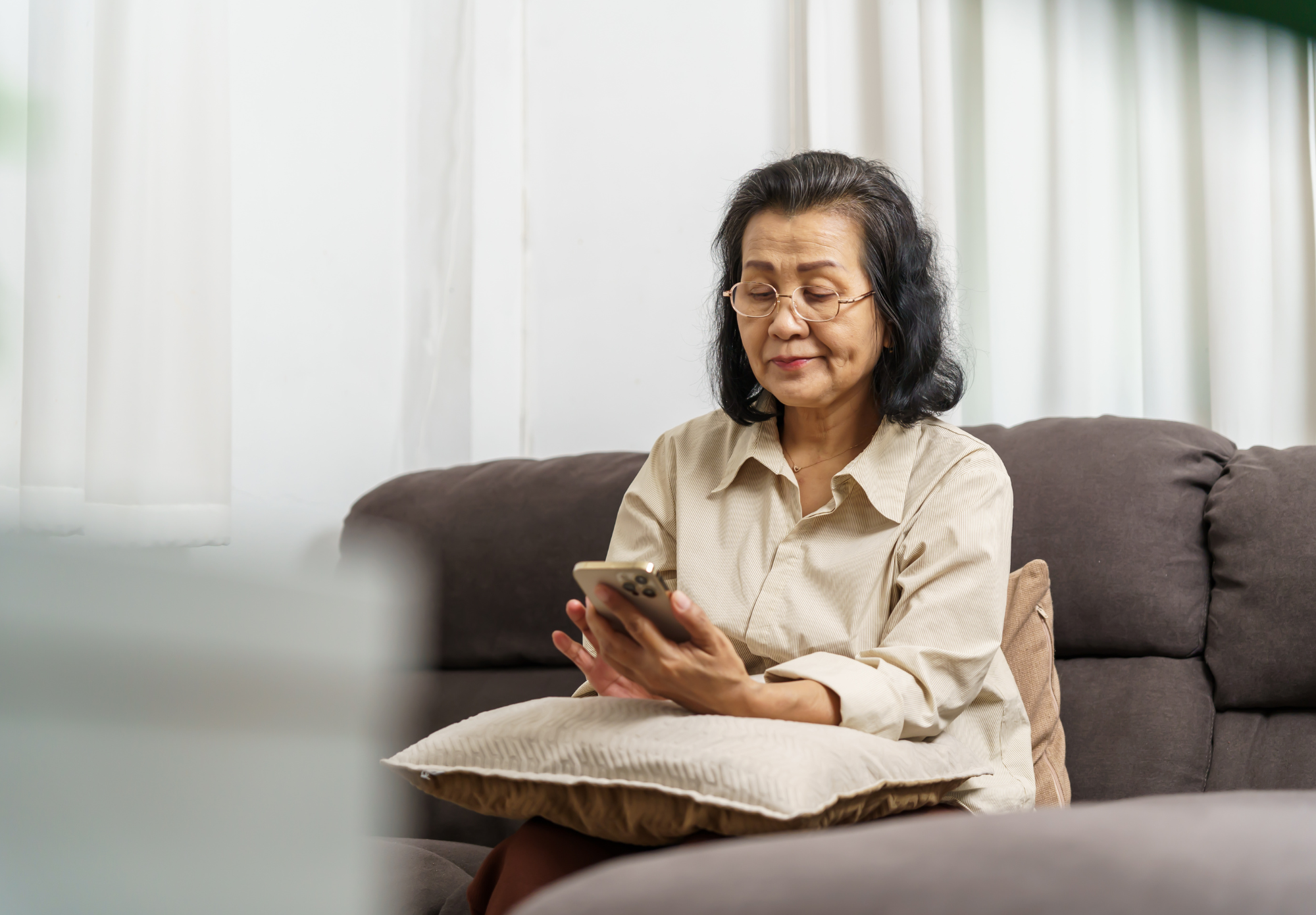 A senior reaching ClaraCare by phone from home