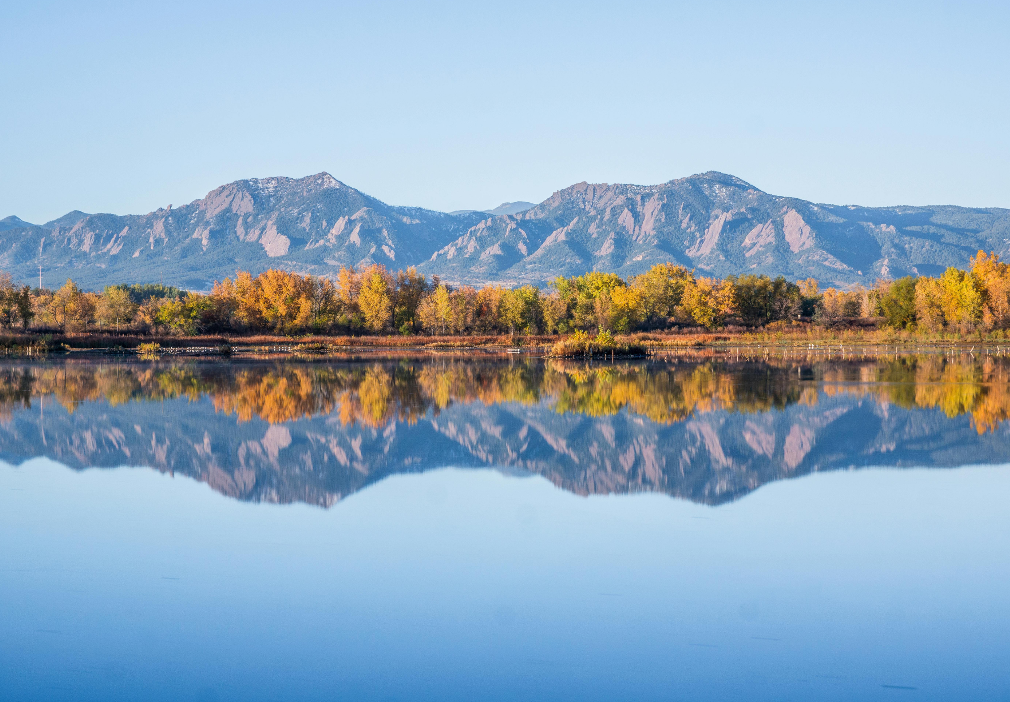 Northern Colorado mountains reflected in a lake at sunrise